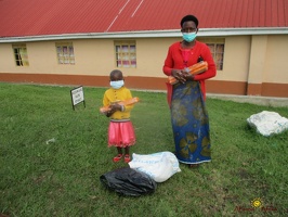 Kansiime Janet's family with thier food package (1)