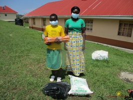 Nyangoma Juliet's family with their food package (2)