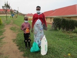 Byaruhanga Innocent's family with thier food package (3)