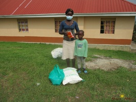 Kajumba Sandrah's family with their food package (3)