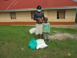 Kajumba Sandrah's family with their food package (4)
