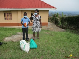 Murungi Ronald's family with thier food package (1)