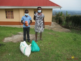 Murungi Ronald's family with thier food package (2)
