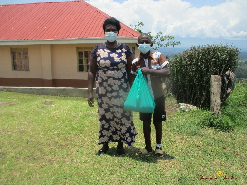 Kwesiga Pauls family with their seeds (1).JPG