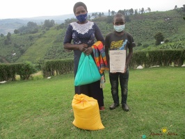 Ahabyona Adolf with their food relief (2)