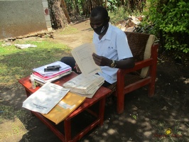 Teacher Kusemererwa Ivan marking home study work (10)